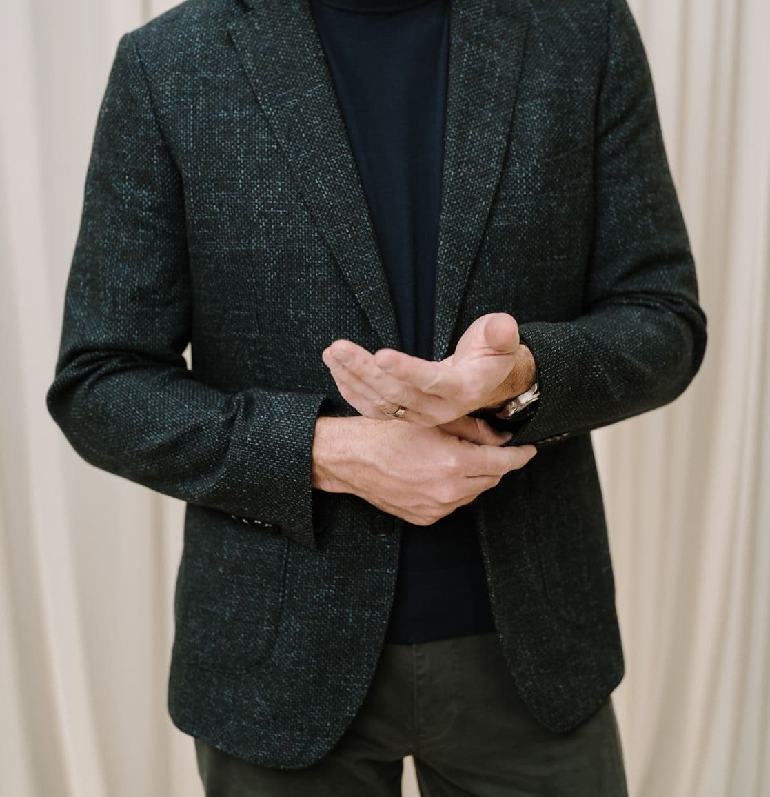 Man standing in dark blue blazer
